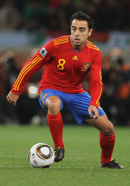 Xavi vs Pirlo Xavi-playing-for-Spain-xavi-hernandez-16584463-414-594